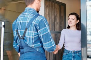 contractor shaking hands with woman