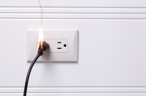 Picture of an electrical socket catching fire