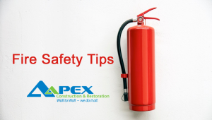 Fire Safety Tips - Aapex Restoration and Construction with a fire extinguisher
