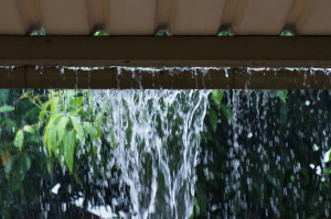 worn out gutters with water spilling everywhere