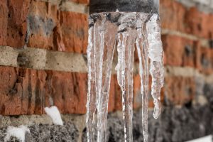 Natural icicles hanging on gutter