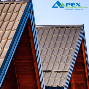 Metal roofing shingle shown on pitched roof demonstrating different roofing materials