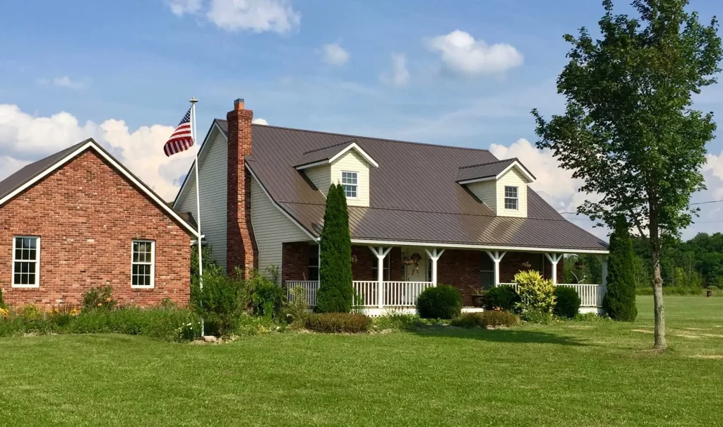 Ranch style home with new brown metal roof