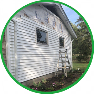 Side of house with ladder