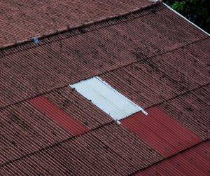 A roof patch that does not match the original color of the roof.