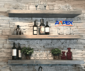 Open shelving layout with various glasses, plants, and bottles sitting on the shelves. Aapex logo top middle right.