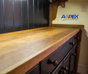 Butcher block counter top. Aapex logo top right.