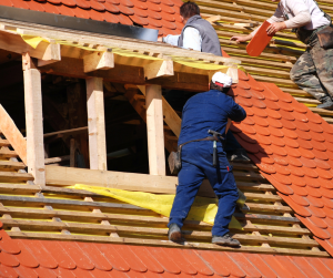 A professional roofing expert, working on installing a new roof.